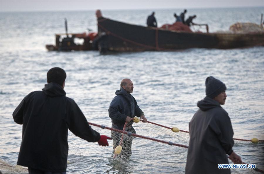 Iranian fishermen work at the Caspian sea beach near Anzali Port, northern Iran, on March 27, 2017. (Xinhua/Ahmad Halabisaz) Iranian fishermen work at the Caspian sea beach near Anzali Port, northern Iran, on March 27, 2017. (Xinhua/Ahmad Halabisaz)