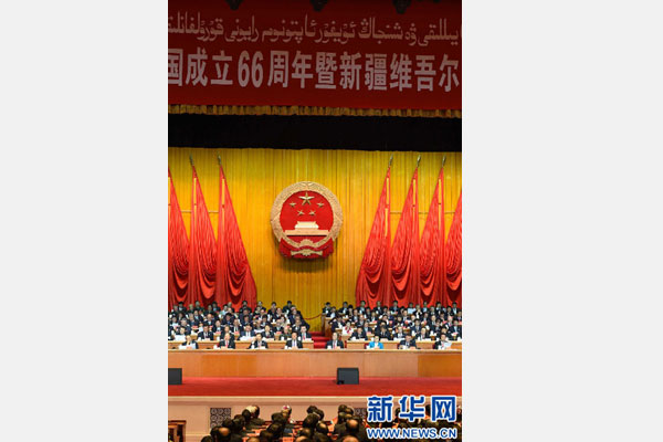 10月1日，慶祝中華人民共和國成立66周年暨新疆維吾爾自治區(qū)成立60周年大會在新疆人民會堂隆重舉行。 新華社記者 高潔 攝 